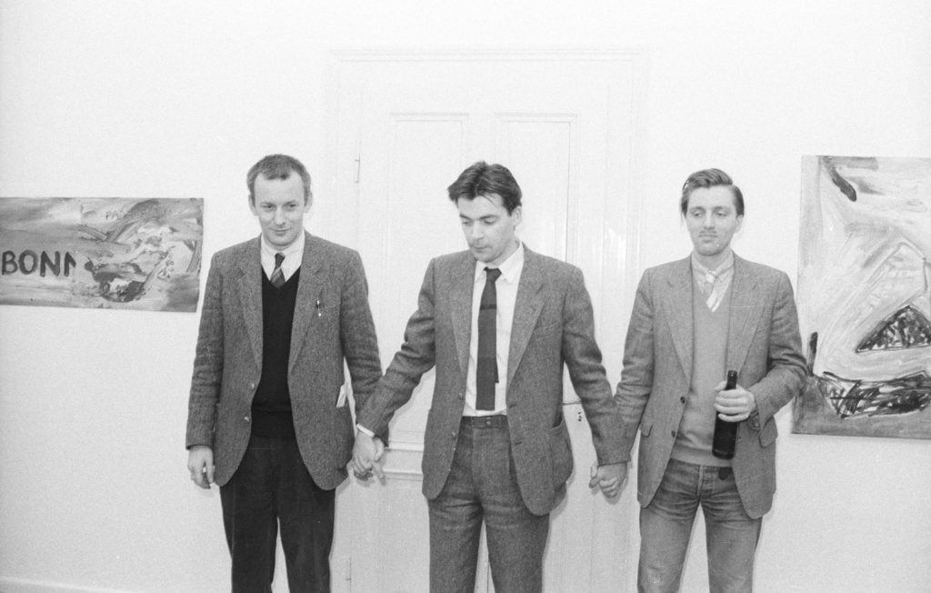 Martin Kippenberger, Werner Büttner, Albert Oehlen at the exhibition "Women in the life of my father" at Galerie Erhard Klein in Bonn in 1983. Photo: Franz Fischer / ZADIK Central Archive for German and international art market research, Cologne (ZADIK).