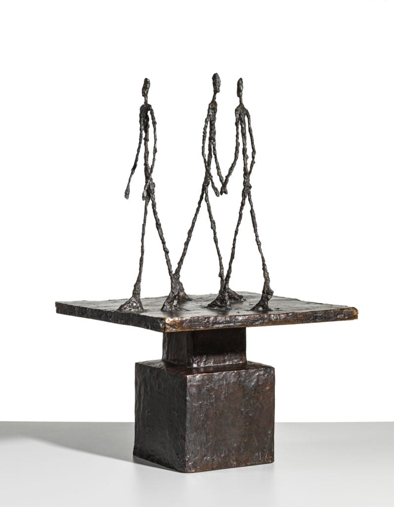 Alberto Giacometti, <em>Trois hommes qui marchent (Grand plateau)</em> (1950). Sold for £11,272,500 at Christie's London on January 5, 2020. Image courtesy Christie's.