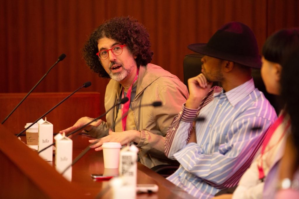 Hrag Vartanian speaks at the 2019 Art World Conference in New York. Photo by Alexa Hoyer, courtesy of the Art World Conference.