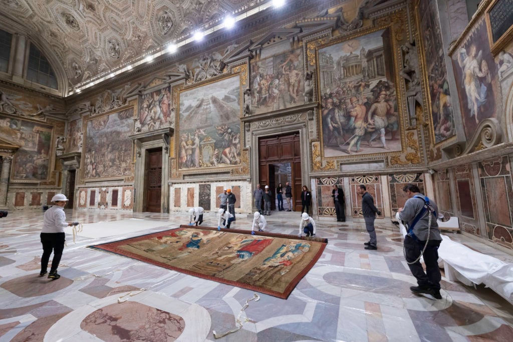 Installation of Raphael's tapestries at the Sistine Chapel. Photo courtesy of the Vatican Museums.