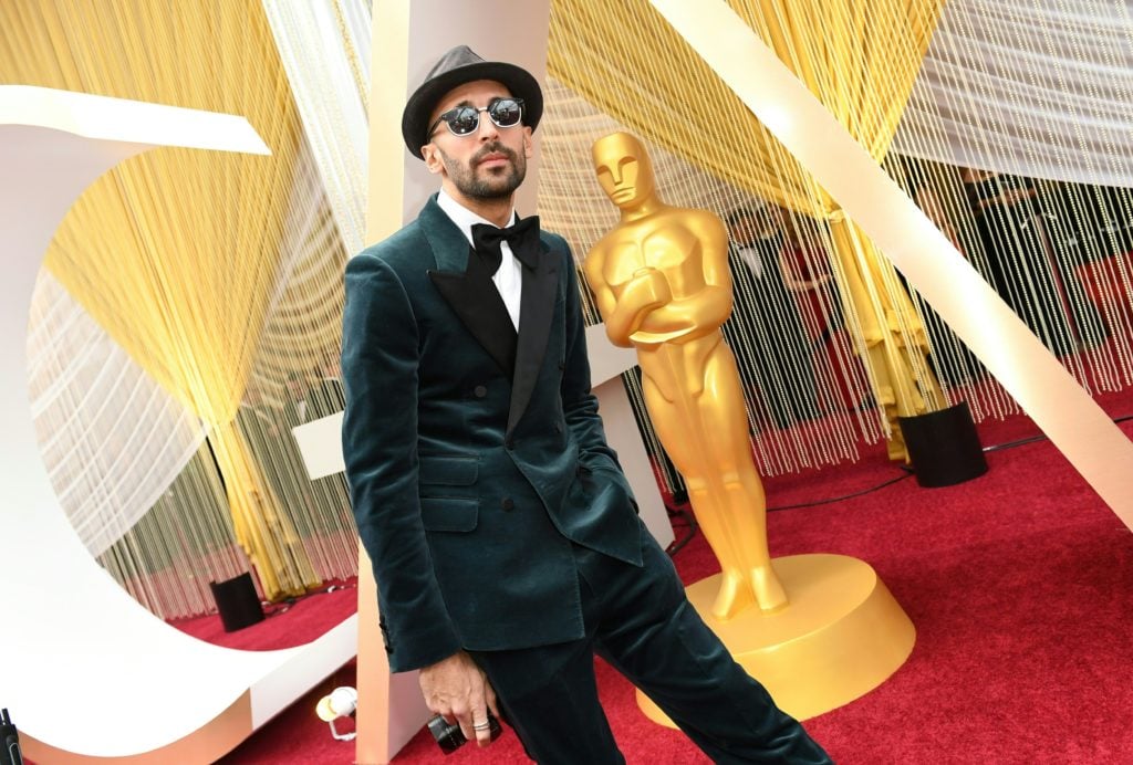 French artist JR poses on arrival the 92nd Oscars at the Dolby Theatre in Hollywood, California on February 9, 2020. Photo by Valerie Macon/AFP/Getty Images.