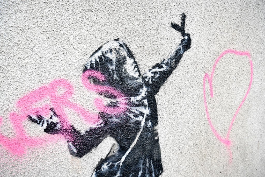 Banksy's vandalized Valentine's Day message in Barton Hill, Bristol. Photo by Ben Birchall/PA Images via Getty Images.