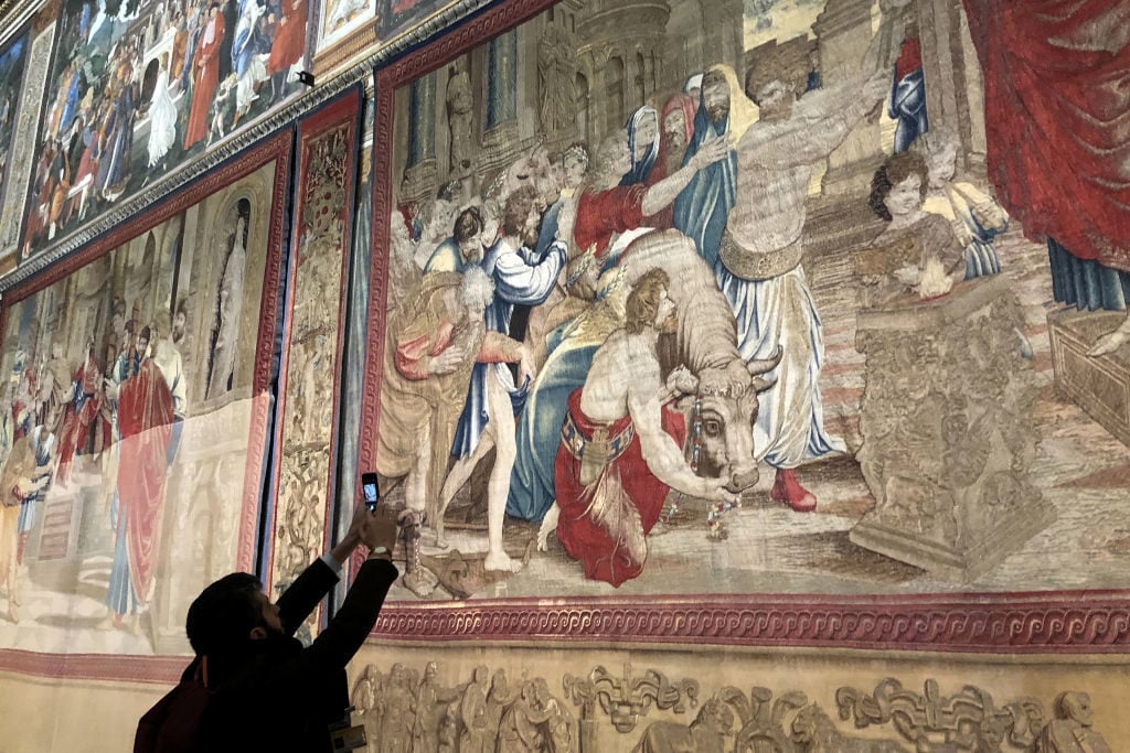 A tapestry of The Acts of the Apostles designed by Italian artist Raphael on display at the Sistine Chapel. Photo by Vera Shcherbakova/TASS (Photo by Vera ShcherbakovaTASS via Getty Images.