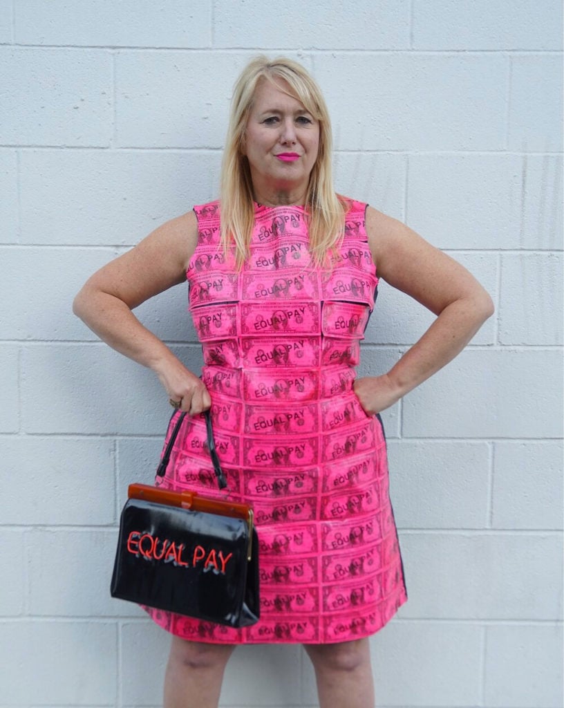Michele Pred in her Equal Pay Dress with her Equal Pay purse (2020). Photo by Bud Snow, courtesy of Michele Pred.