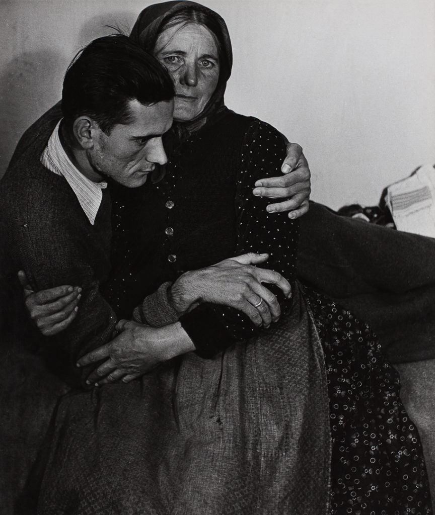 Madame d'Ora, <i>Woman supporting a sickly man at a displaced persons camp in Austria</i> (1948). © Nachlass Madame d'Ora Museum fur Kunst und Gewerbe Hamburg. 