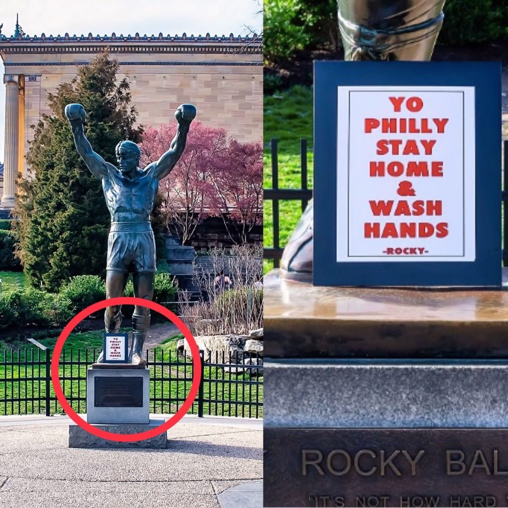 A sign sitting at the base of the Rocky Balboa Sculpture outside the Philadelphia Art Museum. Photo by Gilbert Carrasquillo/Getty Images.