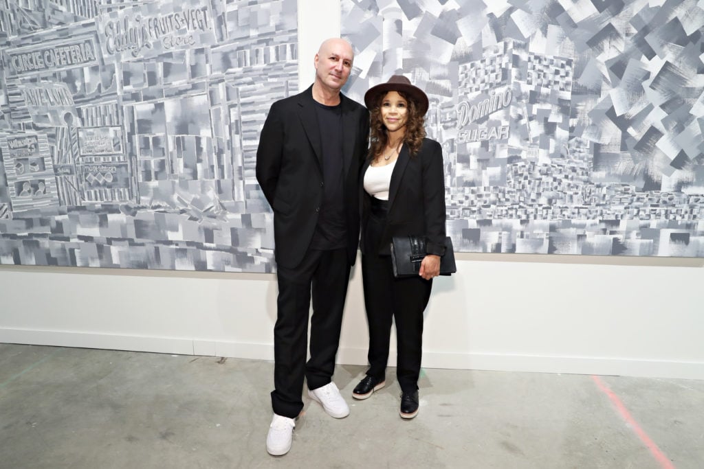 Eric Haze and Rosie Perez with his work at 
