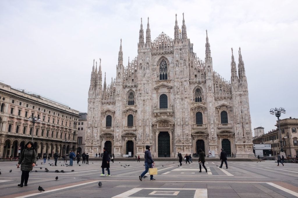 The Duomo of Milan reopens, but the Piazza del Duomo remains deserted on March 3, 2020. Photo by Mairo Cinquetti/NurPhoto via Getty Images.