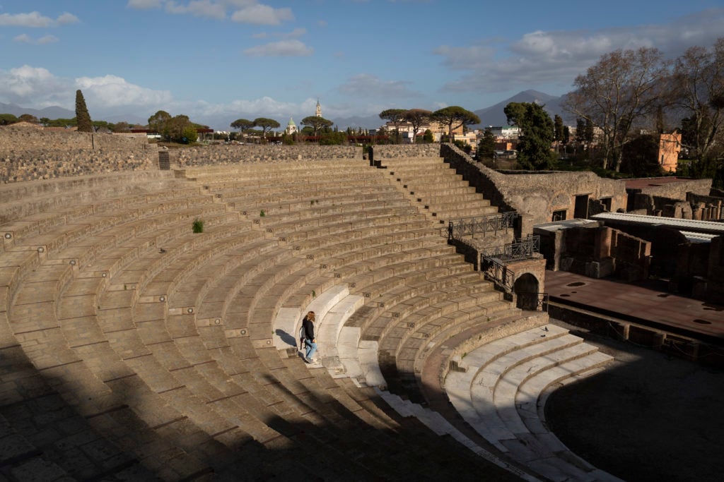 A lone woman walks down the steps of the Great Theatre at the Pompeii Archeological Park on Friday 6th March 2020 in Pompei, Italy. (Photo by Jonathan Perugia/In Pictures via Getty Images).