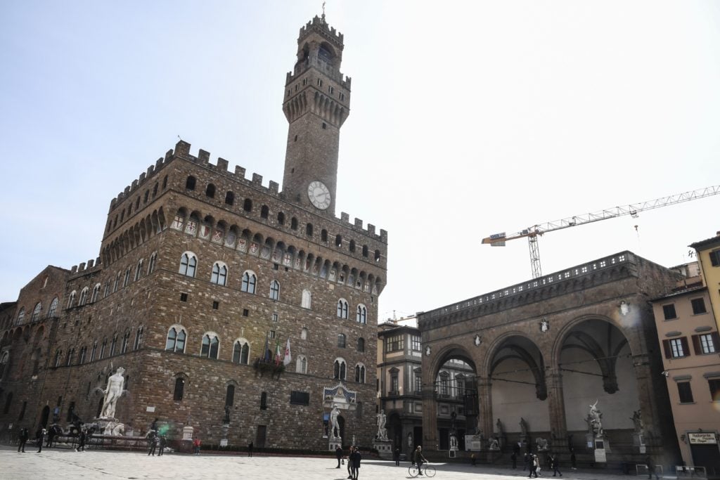 A vacant Piazza della Signoria and Palazzo Vecchio in Florence, as Italy imposed unprecedented national restrictions on its 60 million people on March 10 to control the deadly coronavirus. (Photo by Carlo BRESSAN / AFP via Getty Images)