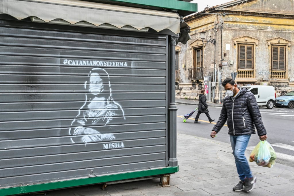 Coronavirus street art by #Catanianonsiferma (Catania does not stop) in Catania, Italy. Photo by Fabrizio Villa/Getty Images.