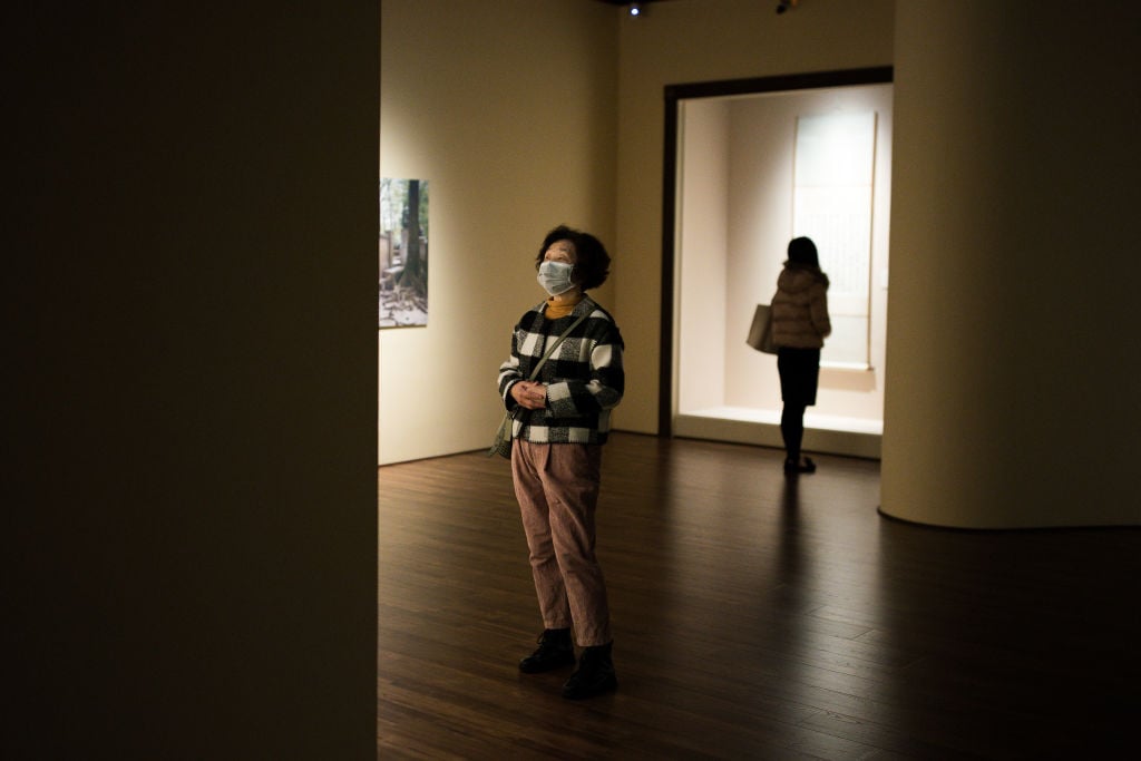 A visitor wearing a protective mask at the Shanghai Museum. Photo: Yifan Ding/Getty Images.