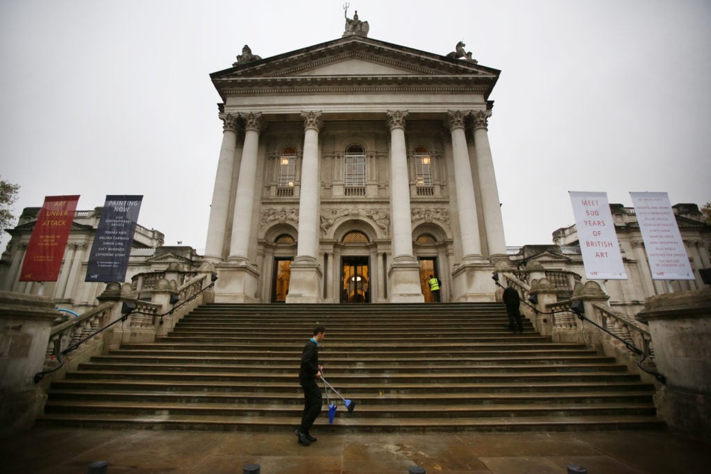 A worker clearing the steps at Tate Britain in London. Photo by Peter Macdiarmid/Getty Images.