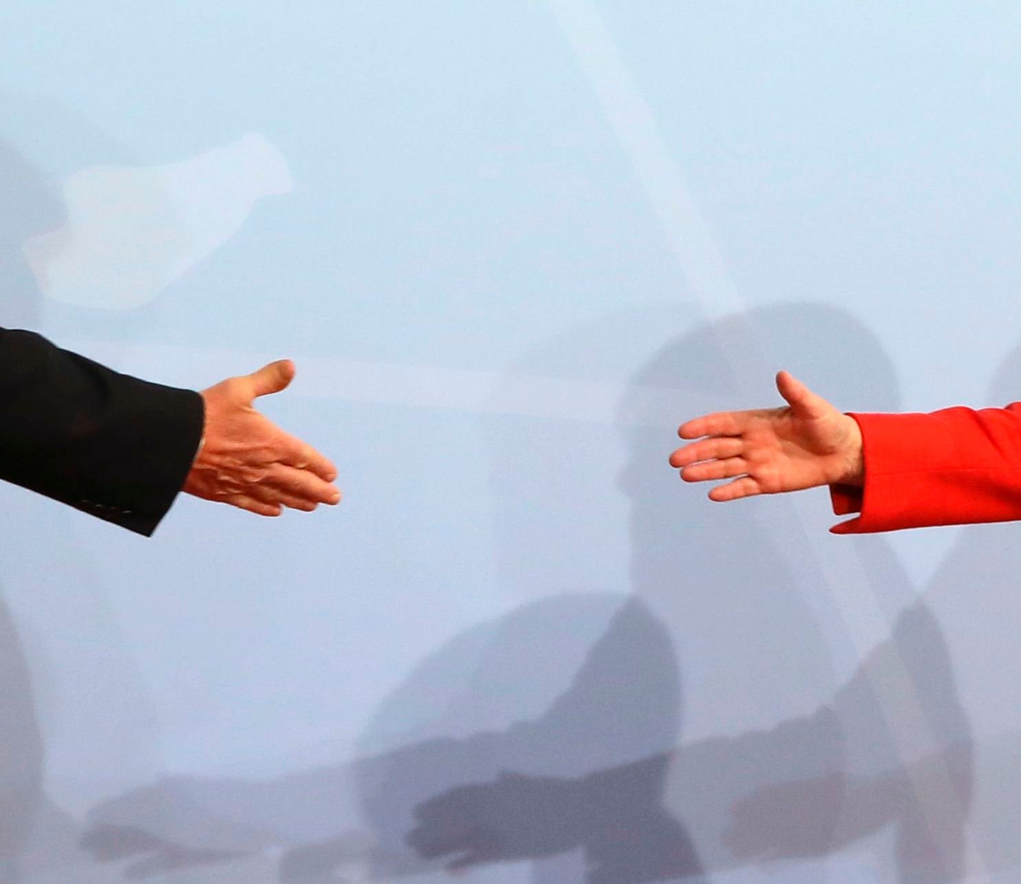 German Chancellor Angela Merkel greets US President Donald Trump at the start of the G20 meeting in Hamburg. (Photo credit: LUDOVIC MARIN/AFP via Getty Images)