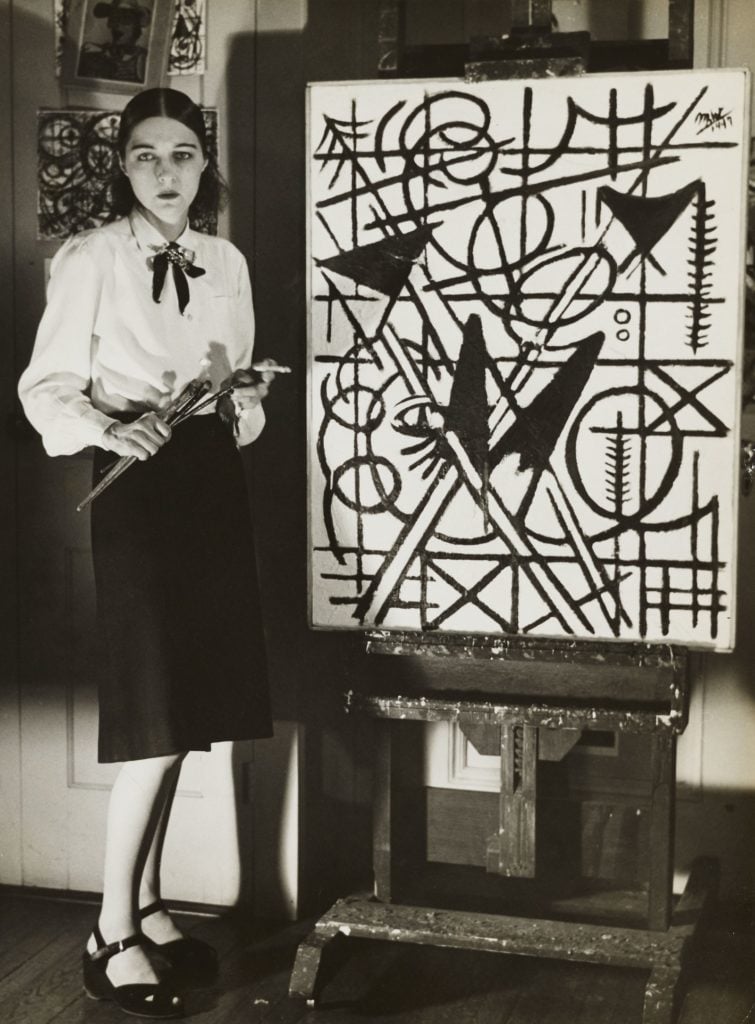 Michael West in her studio with Black and White (1947). Photo courtesy of the Michael (Corinne) West Estate Archives.