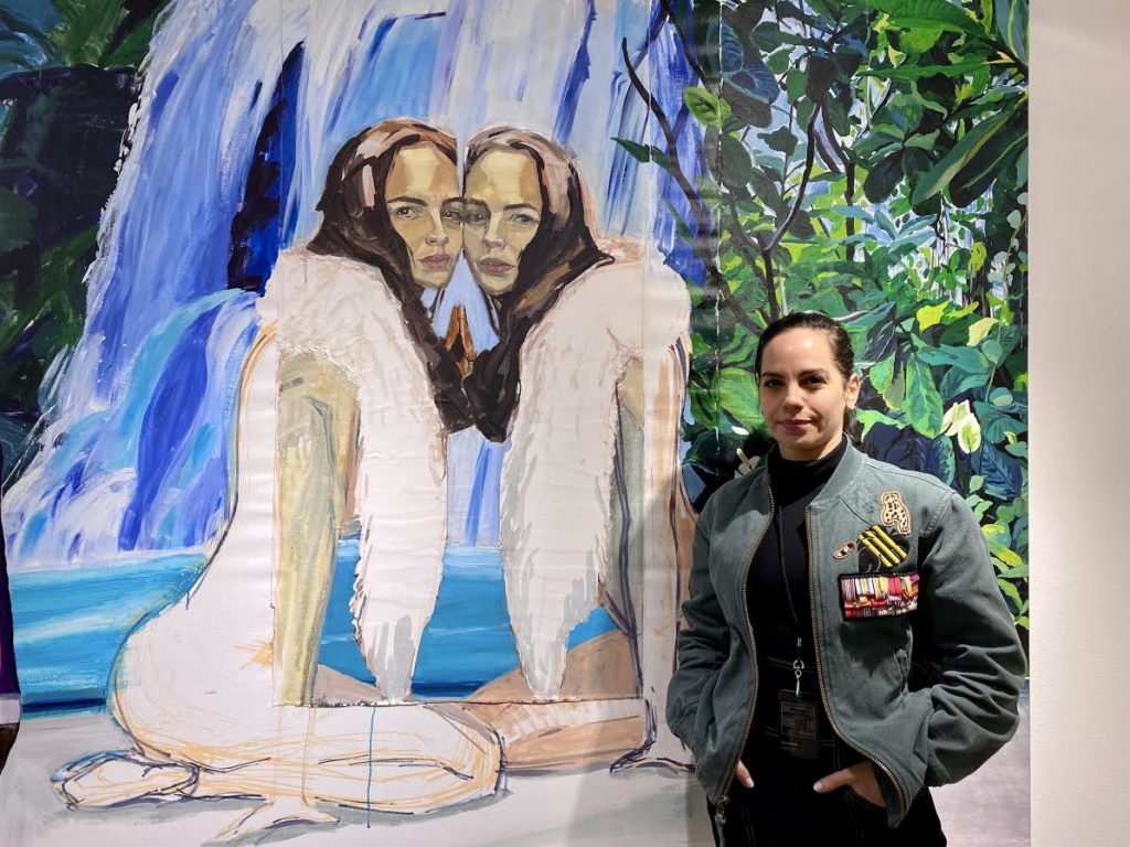 Inbar Hasson with her painting <em>Eve & Eve</em> (2018) at Kyas Art Salon's VOLTA booth. Photo by Sarah Cascone. 
