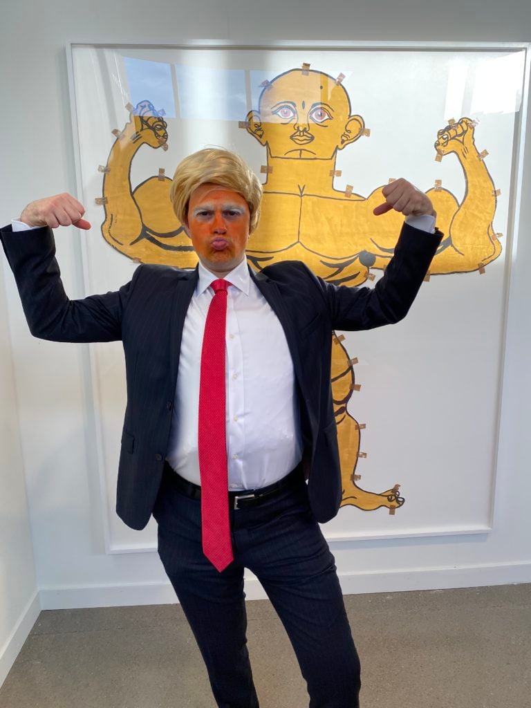 Tootsie Warhol as Donald Trump in front of work by Misleidys Francisca Castillo Pedroso from Parker Gallery at the Independent Art Fair. Photo courtesy of Tootsie Warhol.