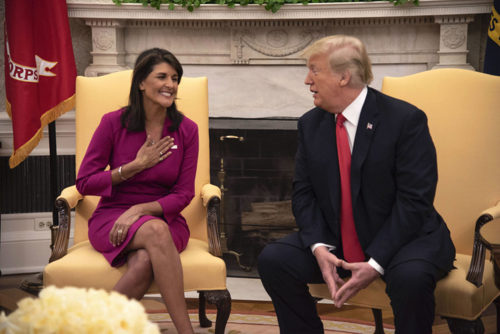 President Donald Trump complements Nikki Haley after she announced her plan to resign as United Nations ambassador on October 9, 2018 in Washington, D.C. Photo by Calla Kessler/The Washington Post via Getty Images.