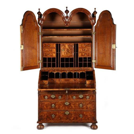 Queen Anne burr walnut & feather banded double dome bookcase (circa 1705). Courtesy of Millington Adams.
