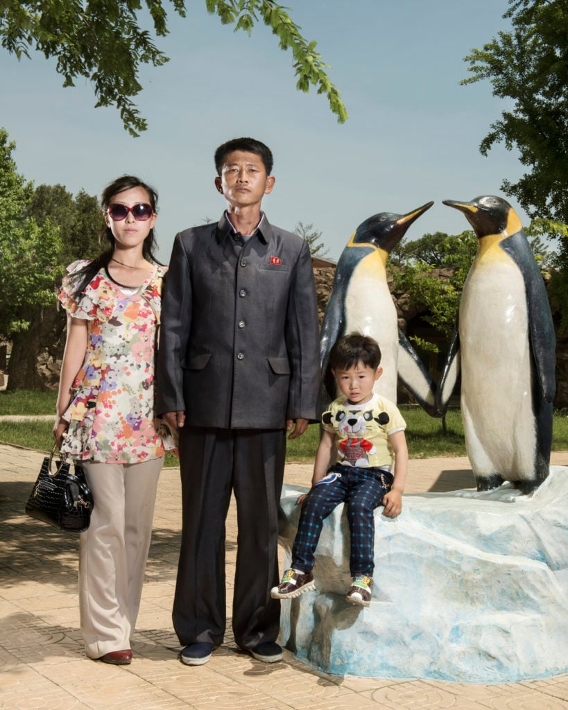 A portrait by photographer Stéphan Gladieu of a family in Pyongyang central zoo in North Korea. The artist will be included in Les Rencontres d’Arles. Courtesy of School Gallery/Olivier Castaing.