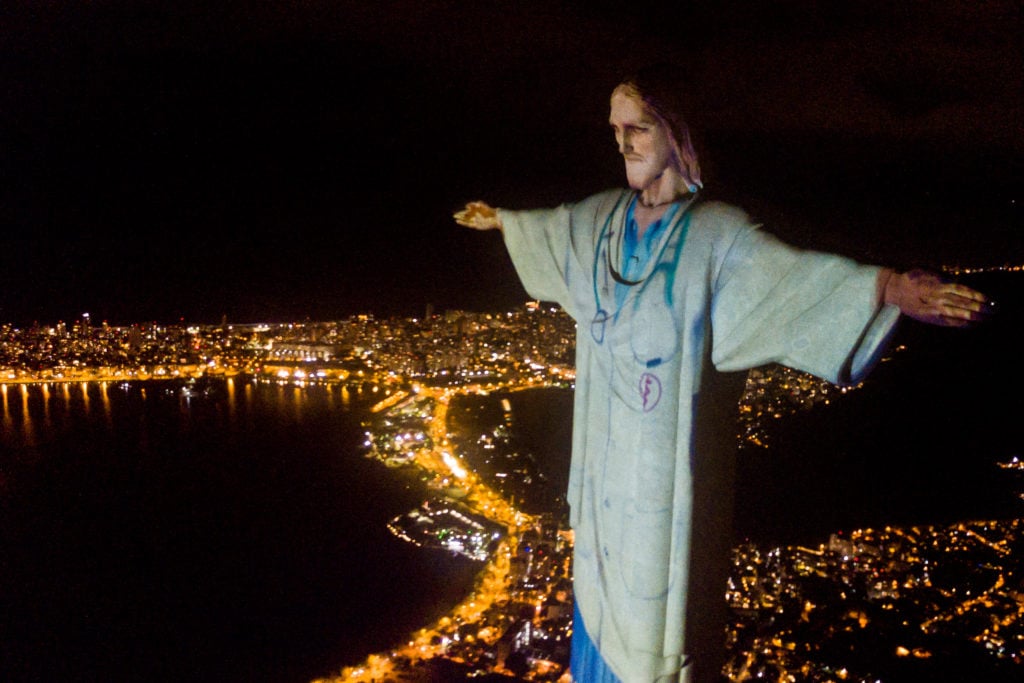 Aerial view of the illuminated statue of Christ the Redeemer as Archbishop of the city of Rio de Janeiro. (Photo by Buda Mendes/Getty Images)