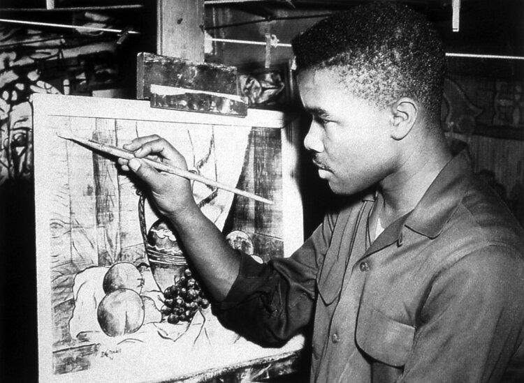 David C. Driskell painting in the basement of Magnolia Deloatch’s house at 3919 Benning Road, North East, Washington, DC (1953). Photo courtesy of the David C. Driskell Papers at the David C. Driskell Center at the University of Maryland, College Park.