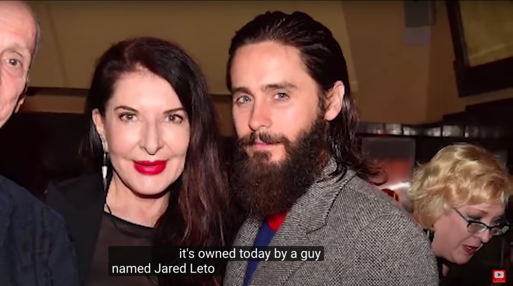 Screenshot showing Marina Abramović and Jared Leto in <em>Out of Shadows</em>.