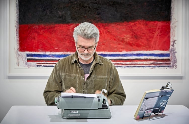 Tim Youd retyping Sylvia Plath's The Bell Jar at the Armory Show, New York, for "100 Novels." Photo courtesy of Cristin Tierney Gallery.