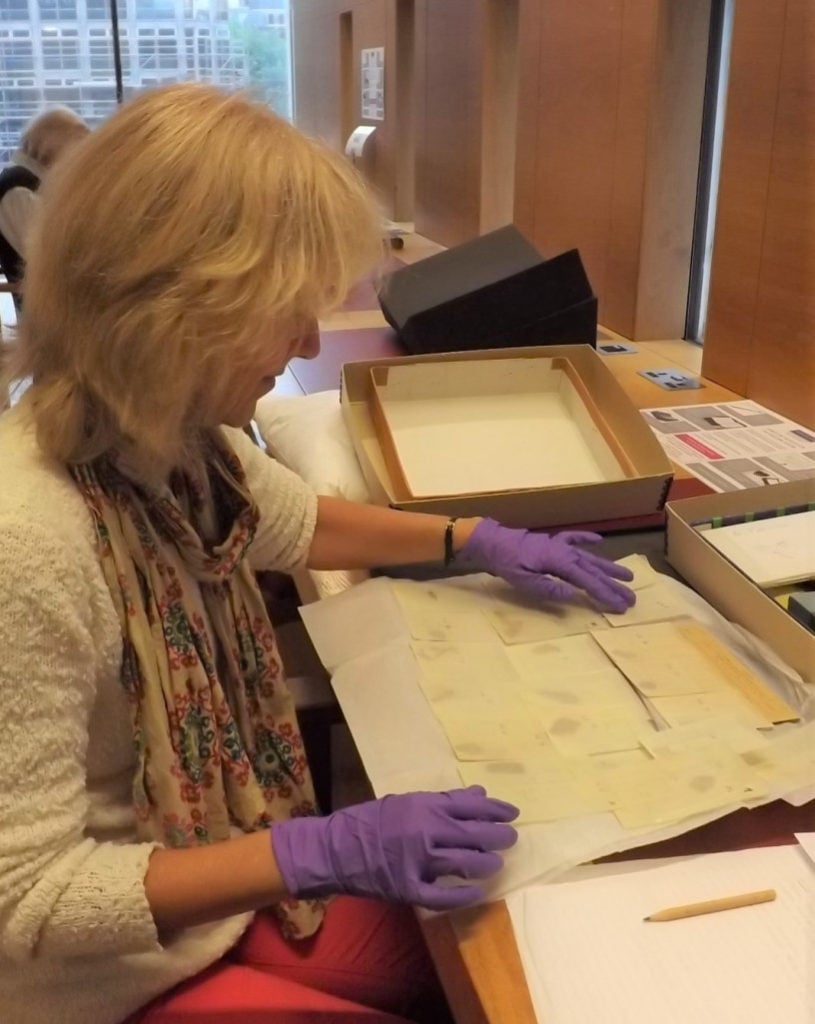 Joan Taylor examining the Dead Sea Scrolls fragments in the John Rylands Library Reading Room. Photo courtesy of the University of Manchester.