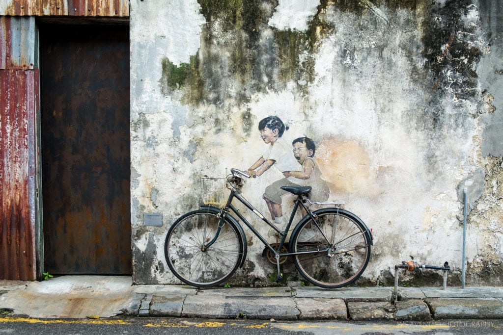 Ernest Zacharevic's <i>Children on a Bicycle</i> is now one of George Town's more popular selfie destinations.