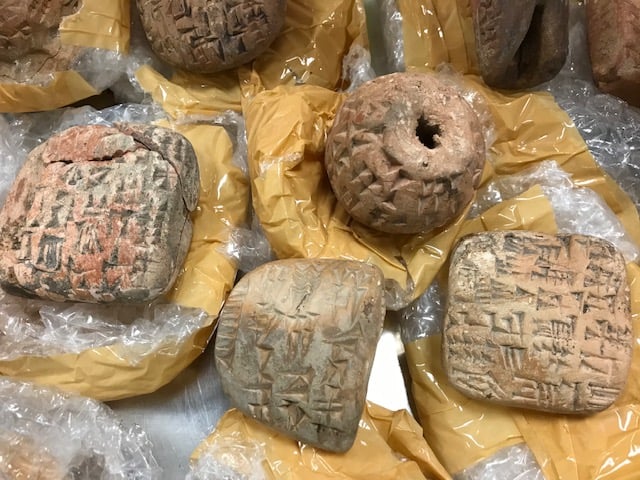 Fake cuneiform tablets in their wrapping. ©Trustees of the British Museum 2020.