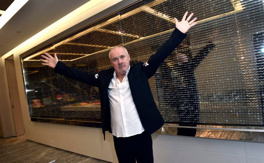 Artist Damien Hirst poses in the 