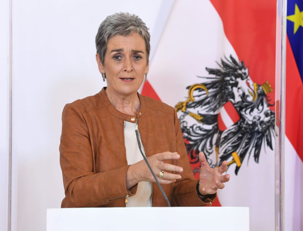 Austria's culture minister Ulrike Lunacek addresses the press from behind a protective plexiglass wall on April 17, 2020 in Vienna, Austria. (Photo by HELMUT FOHRINGER/APA/AFP via Getty Images)