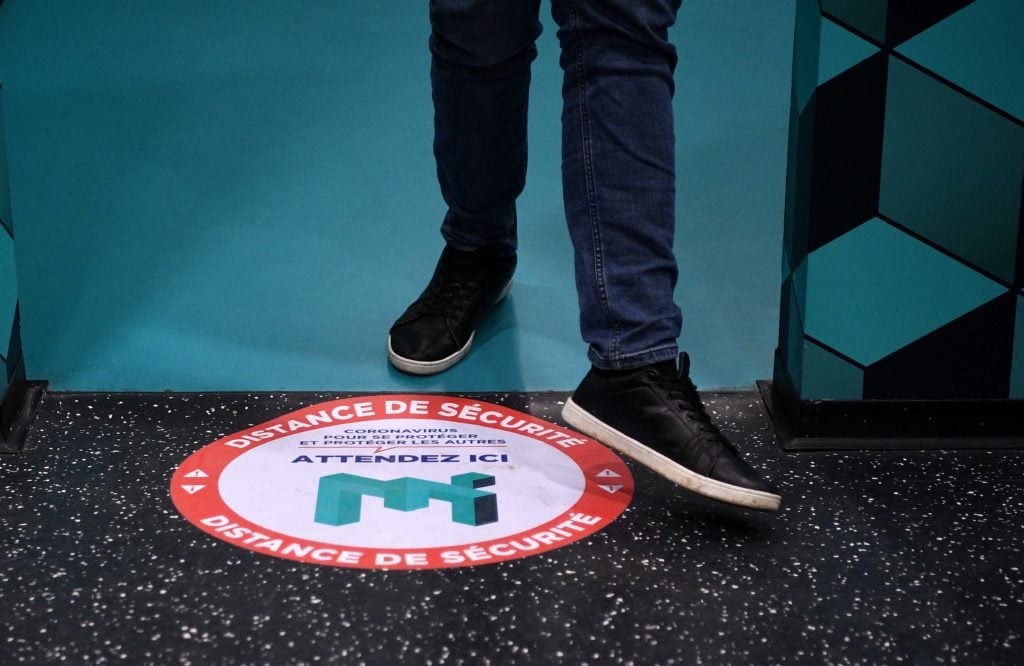 This picture taken on May 13, 2020 shows a social distance marker on the floor of the Museum of Illusion in Paris. (Photo by FRANCK FIFE/AFP via Getty Images)