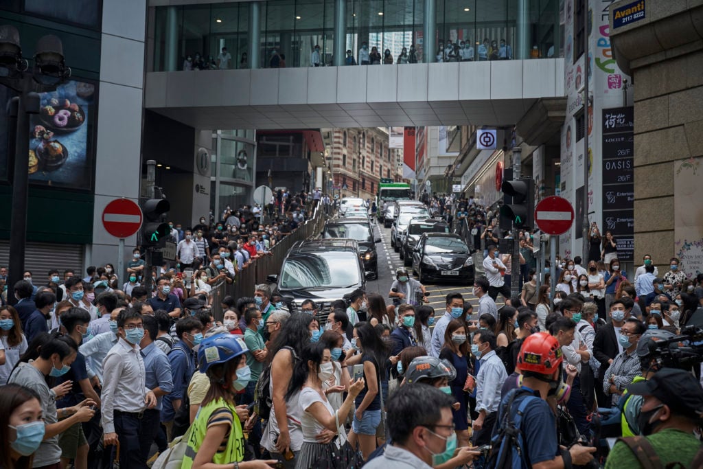 Hundreds of demonstrators flood the streets of Hong Kong on May 27, 2020. The mass protests in Central followed a morning of relative calm as lawmakers prepared to debate a contentious national anthem law at the Legislative Council. (Photo by Tang Yan/SOPA Images/LightRocket via Getty Images)