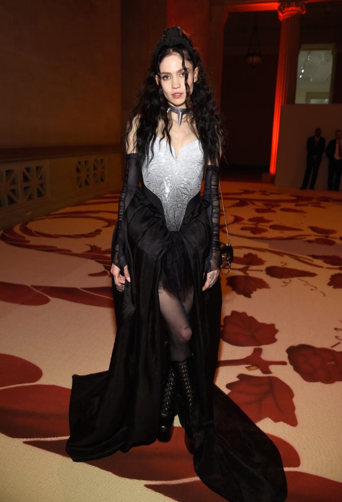 Grimes attends the Heavenly Bodies Costume Institute Gala at the Met. (Photo by Kevin Mazur/MG18/Getty Images for The Met Museum/Vogue)