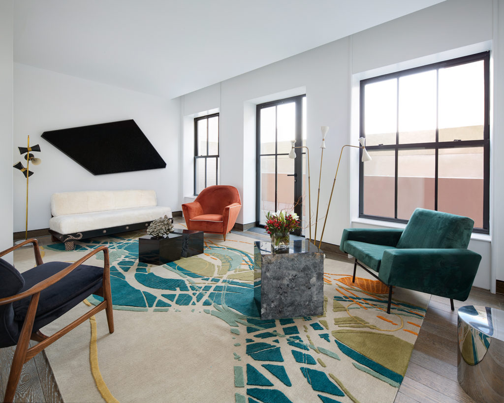 A room featuring furniture by Ettore Sotsass and art by Ted Lawson. Photo courtesy 111 West 57th Street.