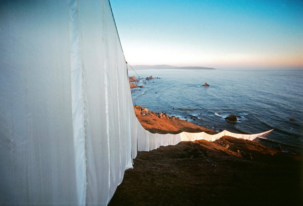 Christo and Jeanne-Claude, <em>Running Fence</em>, Sonoma and Marin Counties, California, (1972–76). Photo by Wolfgang Volz ©1976 Christo.