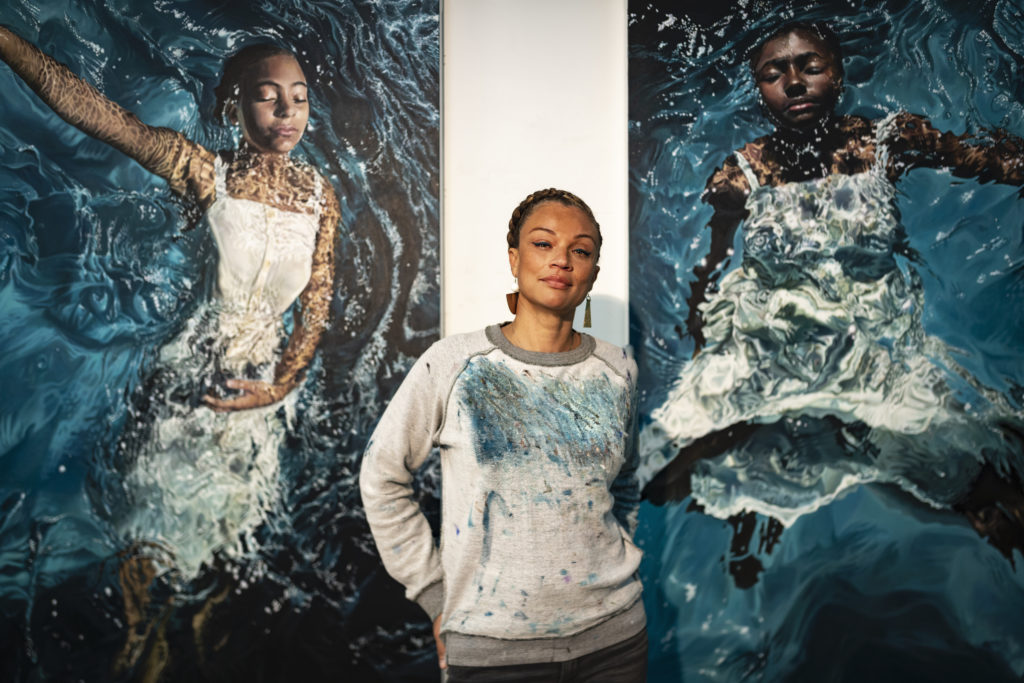 Rawles flanked by her two works 'Reflecting My Grace' (2019) at left and 'Radiating My Sovereignty' (2019) at right. Photo by Glen Wilson.