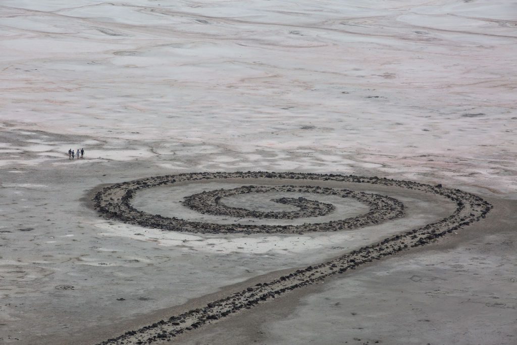 Robert Smithson's Spiral Jetty earthwork sculpture can be seen on the Northern shore of the Great Salt Lake in Utah. 26 August 2018. Built of mud, salt crystals, and basalt rocks, Spiral Jetty forms a 1,500ft long, 15ft wide counterclockwise coil jutting from the shore of the lake. It is located down a remote gravel road far away from any local towns. PHOTOGRAPH BY Adam Gray / Barcroft Images (Photo credit should read Adam Gray / Barcroft Media via Getty Images)