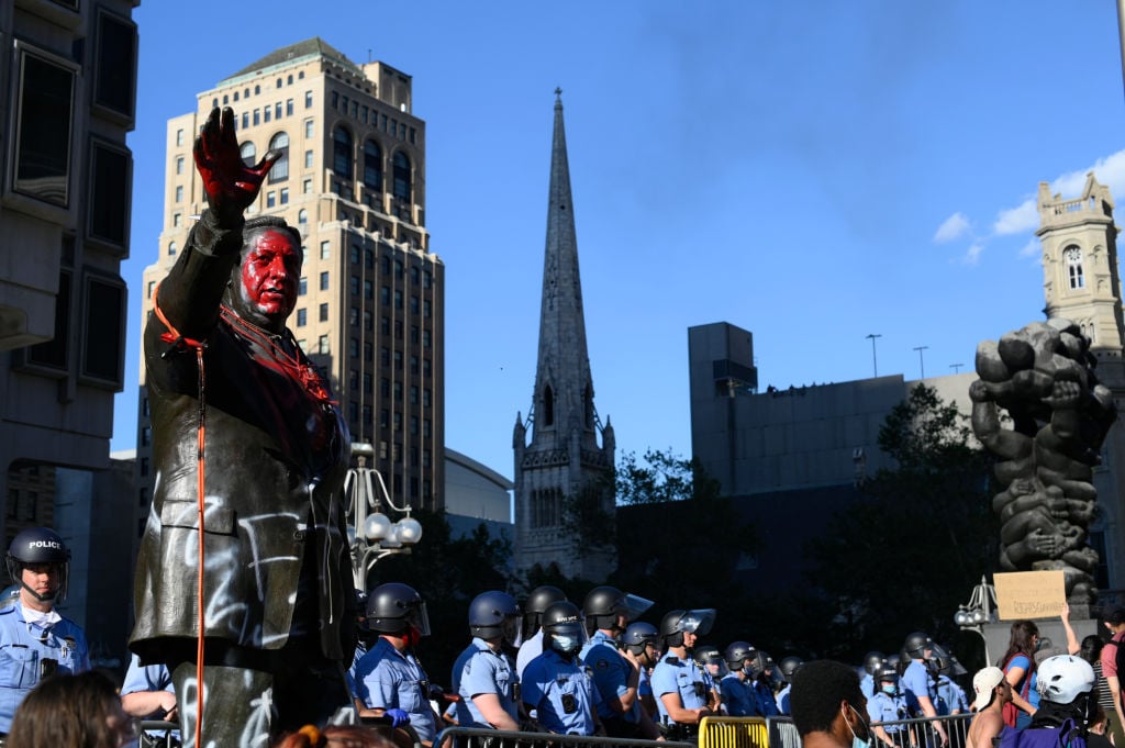 Police officers guard the controversial Frank Rizzo statue as protestors clash with police near City Hall, in Philadelphia, PA on May 30, 2020. Photo by Bastiaan Slabbers/NurPhoto via Getty Images.