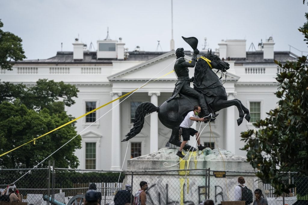 Protesters attempt to pull down the statue of Andrew Jackson in Lafayette Square near the White House on June 22, 2020, in Washington, DC. Police stopped them using pepper spray. Photo by Drew Angerer/Getty Images.