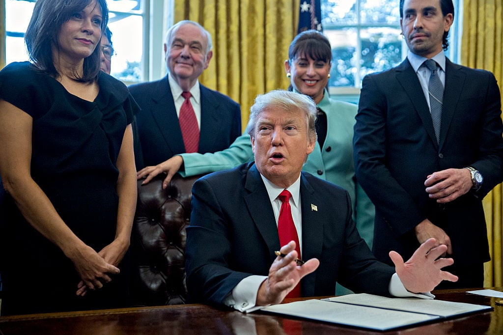 US President Donald Trump speaks before signing an executive order. Photo by Andrew Harrer— Pool/Getty Images.