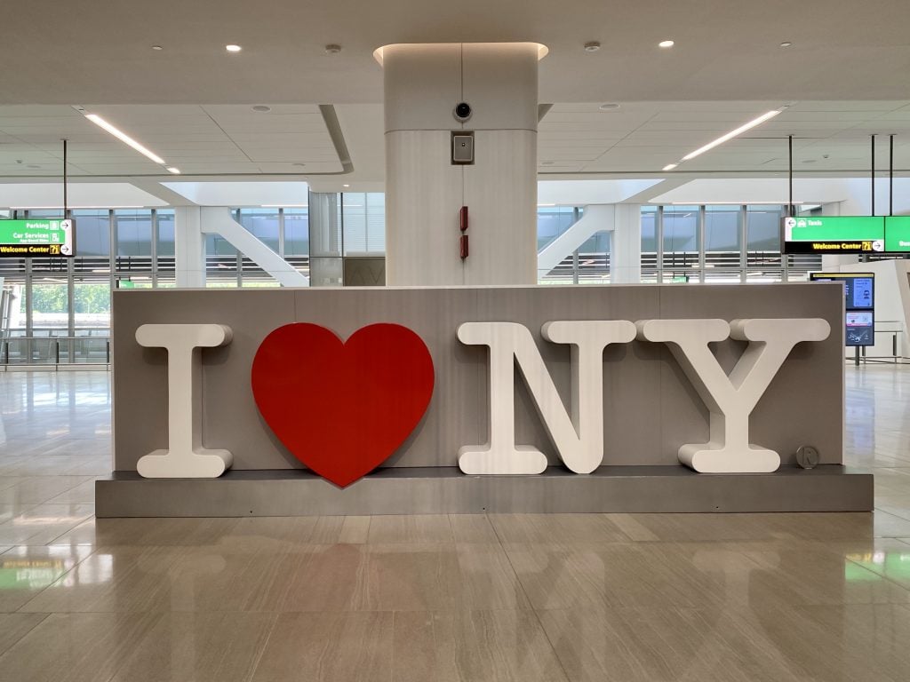 Graphic Designer Milton Glaser's <em>I ♥ NY</em>, designed for a New York tourism campaign in 1977, now greets arrivals at baggage claim at the new LaGuardia Airport terminal in New York City. Photo by Sarah Cascone.