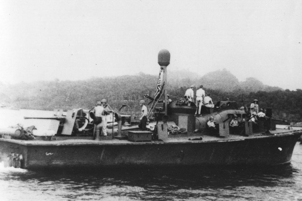 The PT-59, a Navy patrol ship commanded by John F. Kennedy during his Navy service in World War II, as seen in the Solomon Islands. Photo by Jerry Gilmartin, MMC, USN, Ret., courtesy of the US Navy, taken by United States Marine.