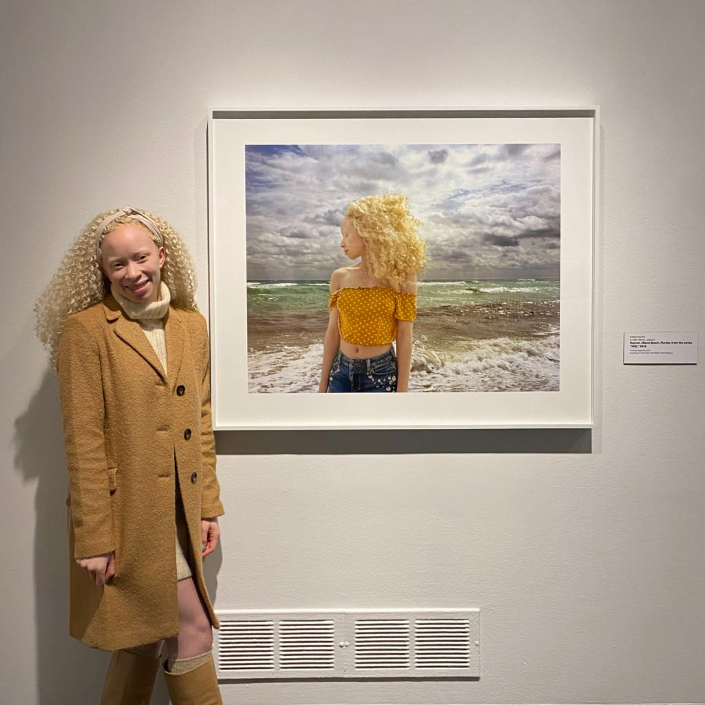 Rayven stands next to Matar’s portrait of her at the opening for “Live Dangerously” at the National Museum of Women in the Arts.