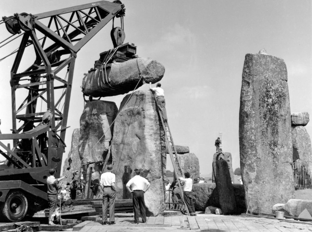 In 1958, workers raised a standing stone at Stonehenge that had fallen down a century behind. Now, a core sample drilled during the repair work has helped identify the mysterious monument's origins. Photo courtesy of English Heritage.