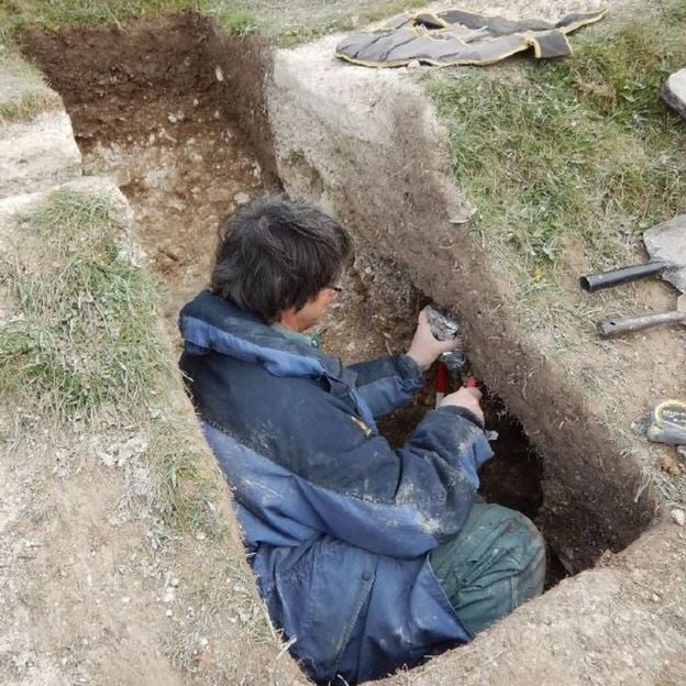 Environmental archaeologist Mike Allen taking samples of the hill figure Cerne Abbas in Dorset, England. Photo courtesy of the National Trust.