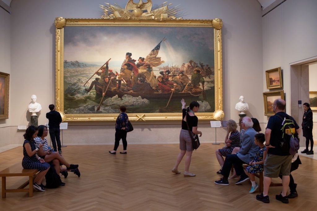 NEW YORK, NY - AUGUST 30: Visitors to the Metropolitan Museum of Art's American wing view Emanuel Leutze's painting 