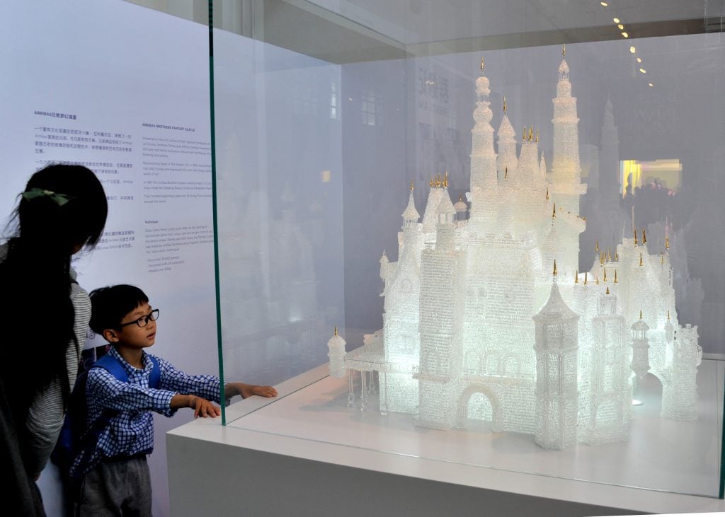The glass sculpture of the Disney castle on view at the Shanghai Museum of Glass. Photo by Visual China Group via Getty Images/Visual China Group/Getty Images.